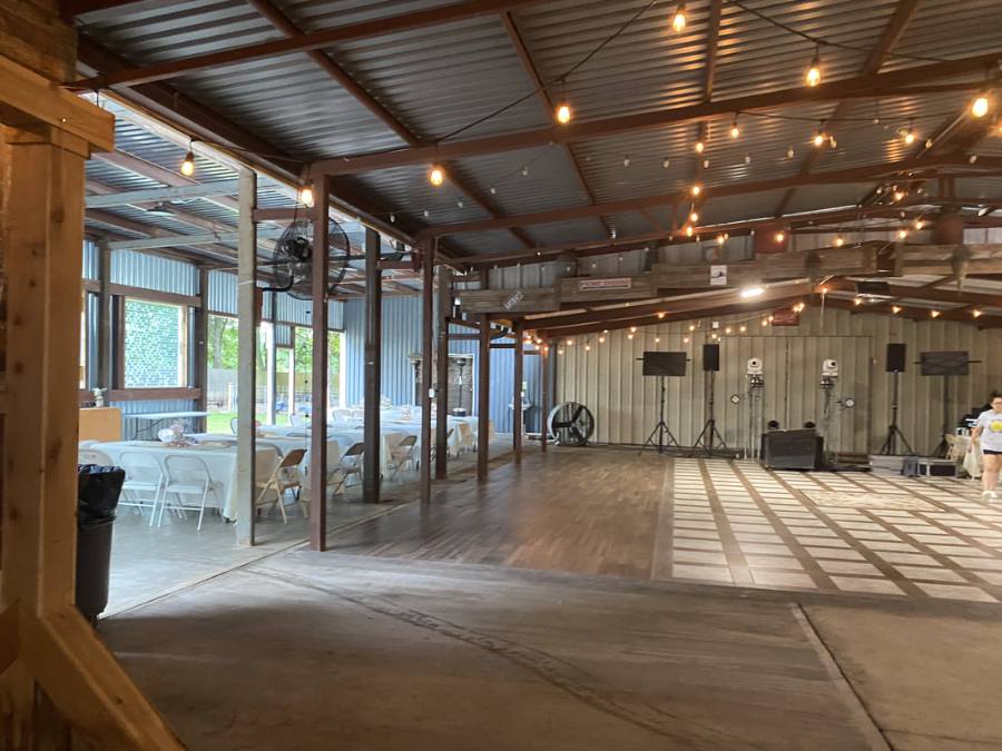 Covered open-air hall with wood beams and open sides
