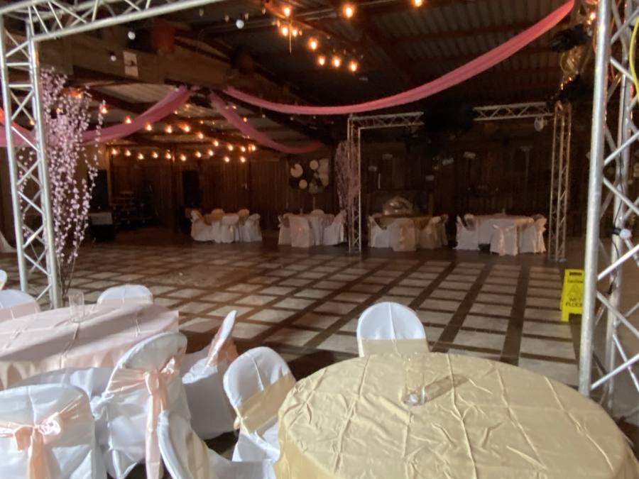 Evening event with pink ceiling drapes and warm lights