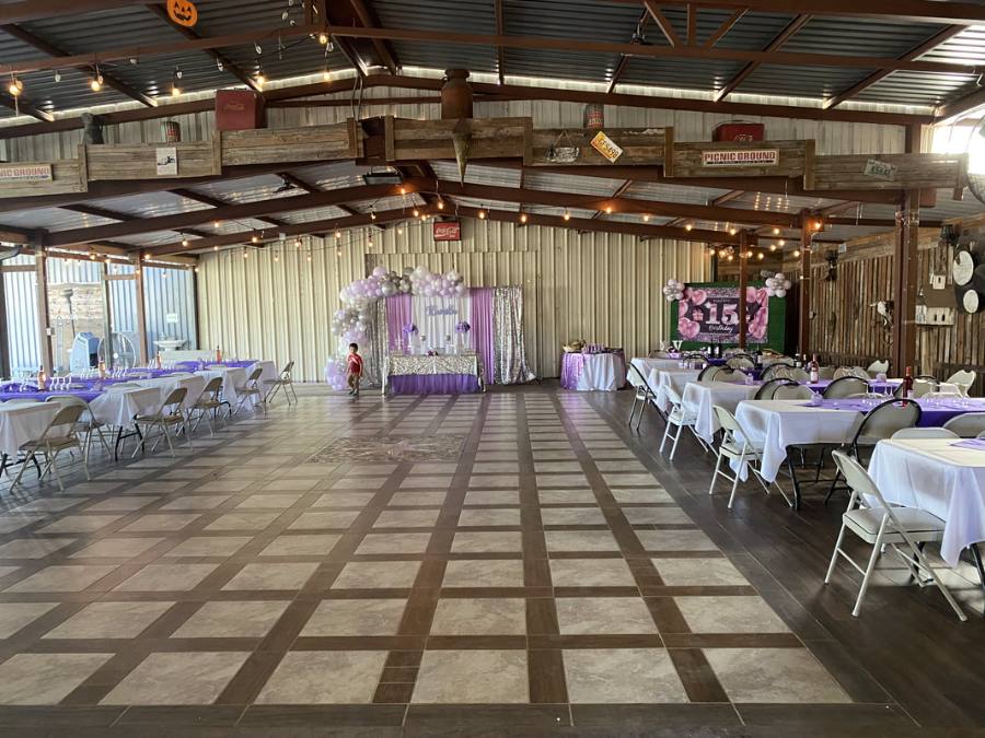 Hall set with purple accents and a decorated head table